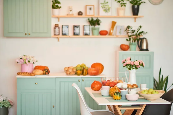 autumn kitchen decoration with pumpkins