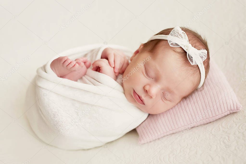 newborn girl on a light background