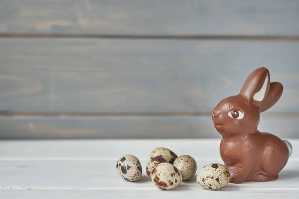 Stock image chocolate bunnies on dark wooden background