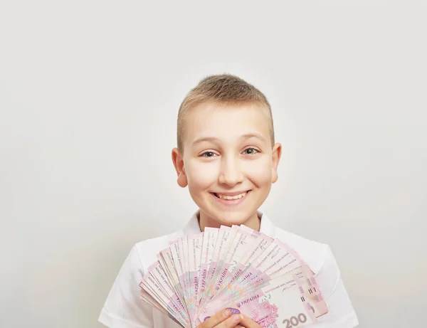 Niño Con Dinero Hryvnia Sobre Fondo Blanco —  Fotos de Stock