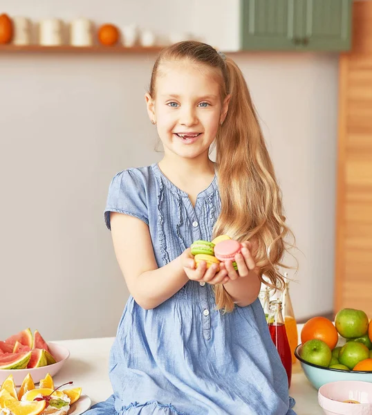 The girl eats fruit pineapple, watermelon, apples and drinks drinks from chia. Healthy food in the children's menu