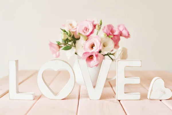 word love with flowers on the table