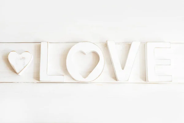 wooden letters love on a white background