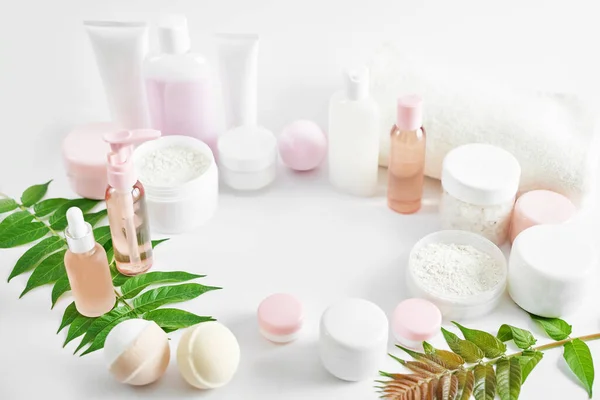Flat lay composition Natural cosmetics ingredients for skincare, body and hair care.Top view bottles with facial treatment product white background. Makeup Layout. Set of traditional spa products