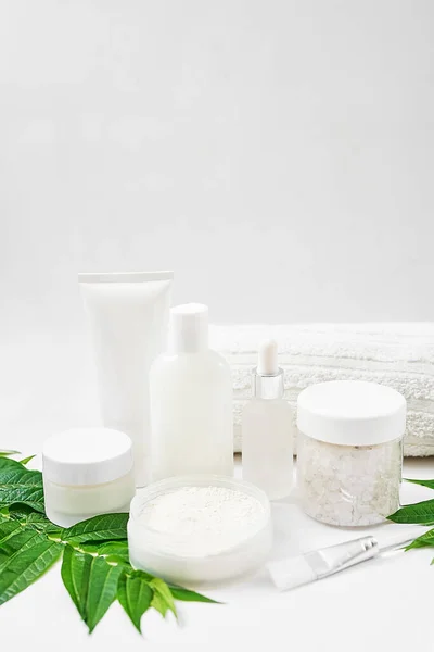 Flat lay composition Natural cosmetics ingredients for skincare, body and hair care.Top view bottles with facial treatment product white background. Makeup Layout. Set of traditional spa products