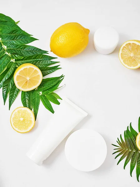Natural organic homemade cosmetics with lemon. Skin care. Spa salon and treatments. Beautician background. Clay, lemon, beauty products.Tropical summer concept. Flat lay, copy space.