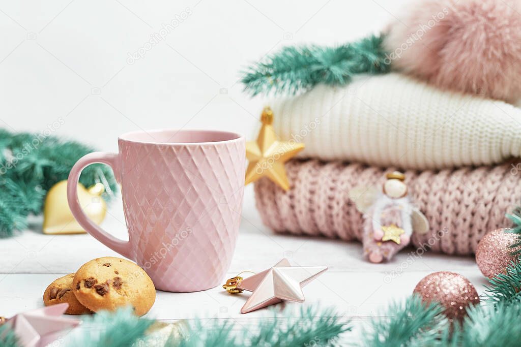 Christmas table setting. Cup of coffee or tea on background of Christmas tree. Christmastime celebration. Winter Holidays. Xmas mock up. Greeting card template