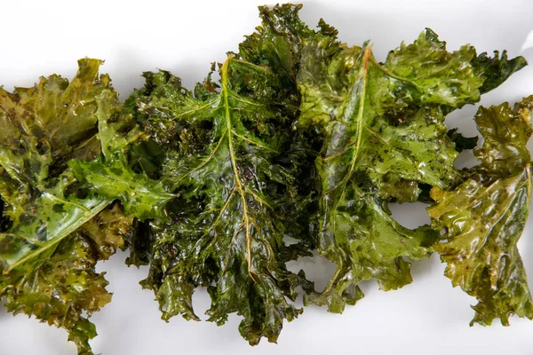 Oven baked olive oil and salt kale chips — Stock Photo, Image