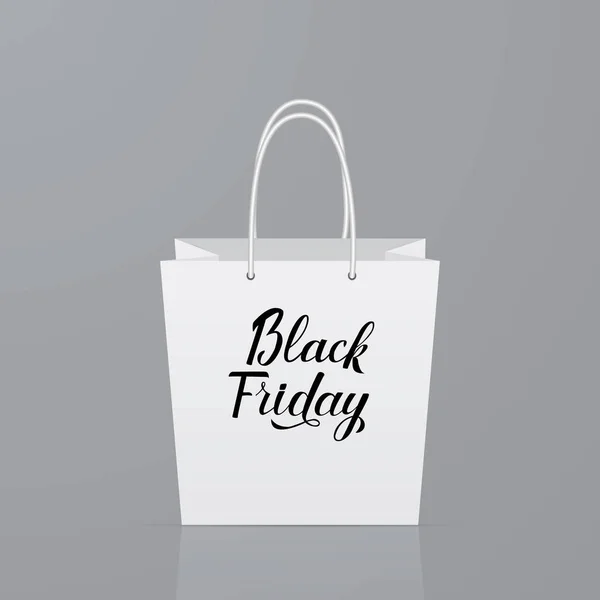 Beyaz kağıt alışveriş çantası üzerine Black Friday kaligrafi yazı. — Stok Vektör
