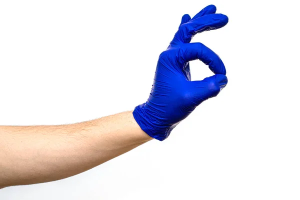 Hand Blauem Handschuh Zeigt Okay Geste Auf Weißem Hintergrund — Stockfoto