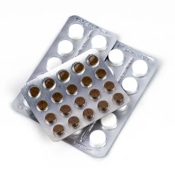 Zwei Packungen Weiße Und Zwei Packungen Braune Tabletten Blasen Auf — Stockfoto
