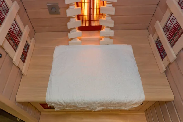 White towel in a privat infrared sauna