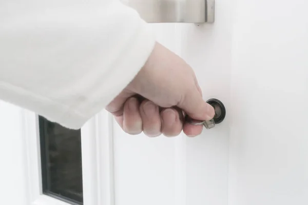 Opening the front door with a key