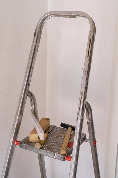 Ladder with different tools