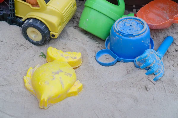 Children toys in the sand box