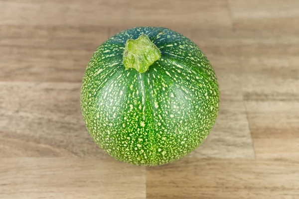 Une Courgette Ronde Sur Table Bois — Photo