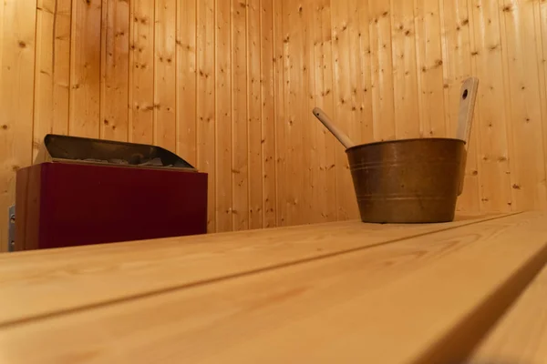 Privat sauna with water bucket and hot oven