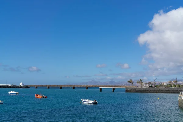 many small fishing boats and row boats in the water