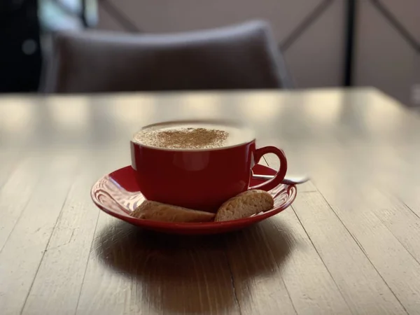 Cup of coffee cuppuccino on wooden table — Stock Photo, Image