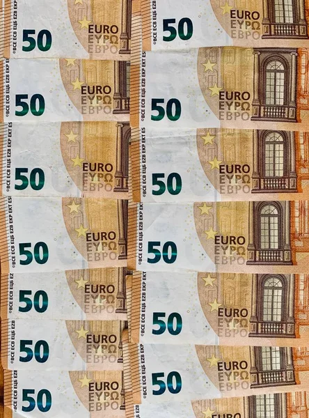 Pile of 50 euro notes pattern business background