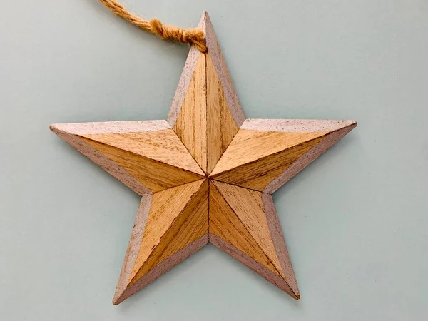 Christmas festive wooden star decoration on white. Christmas background.