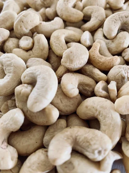 Ořechy Kešu Jsou Roztroušeny Jako Pozadí Stole — Stock fotografie