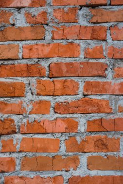 Tuğla işi. Tuğlaların dokusu, arka planı. İnşaat malzemesi, kırmızı taş. Bir sürü kırmızı tuğla..