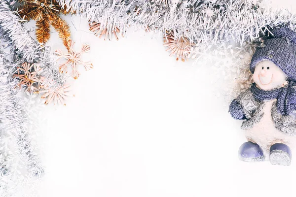 Figure Porcelain Snowman Blue Hat White Background Shiny Christmas Tinsel — Stock Photo, Image