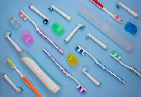 Top view of toothbrushes in colorful on pastel color background. — Stock Photo, Image