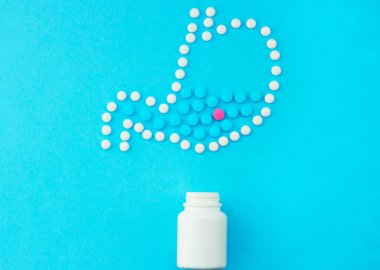 Stomach made of white pills with some red and blue pills inside. clipart