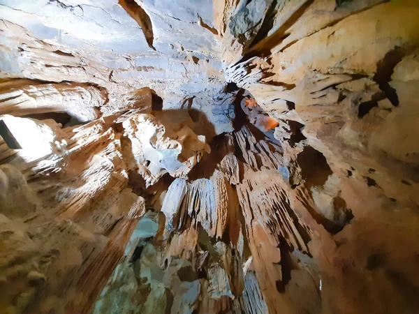 Ancient karst cave with stalactites and stalagmites — Stock Photo, Image