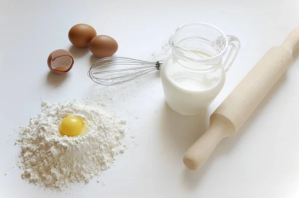 Still life of milk, eggs and flour for making dough