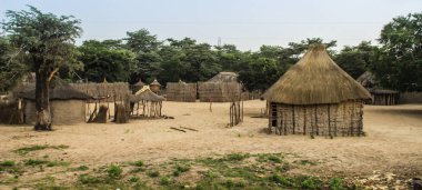 Traditional African authentic huts and straw fences on the border of Zambia and Namibia clipart
