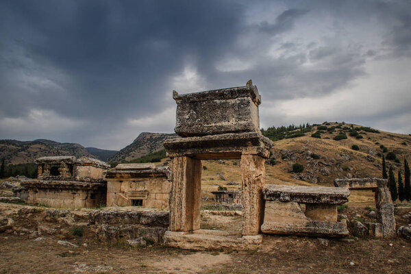 The ruins of the ancient ancient city of Hierapolis with columns, gates and graves in Pamukalle, Turkey