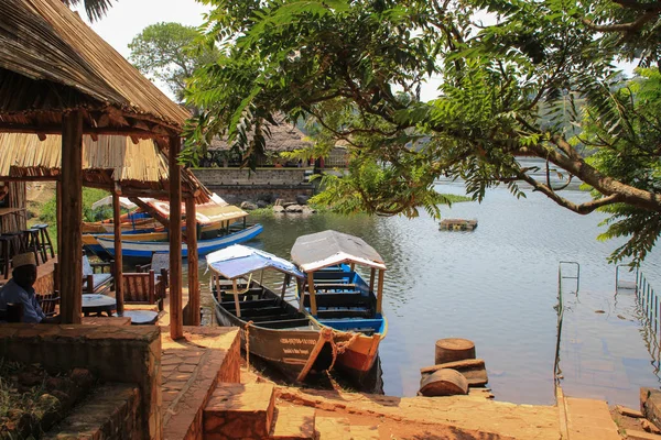 Jinja, Uganda - January 20, 2015: Restaurants and cafes with boats near the source of the Nile River.