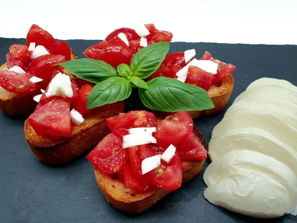 Tomato bread basil mozzarella released on white background