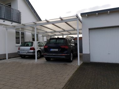 Garage carport for the car at the house clipart