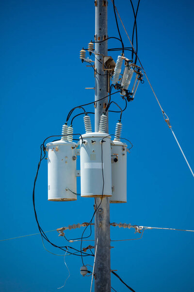 Electric pole with transformer and wires in USA