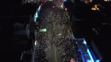 Beginning new year celebration aerial footage view in Yogyakarta monument or TUGU JOGJA with people crowd and fireworks launch