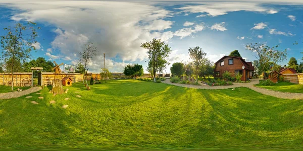 panorama outside vacation wooden village home in sunny evening day . Full 360 degree seamless panorama in equirectangular spherical projection