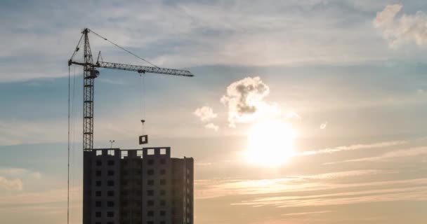 Time Lapse Silhouette Tower Crane Working Construction Rays Setting Sun — Stock Video