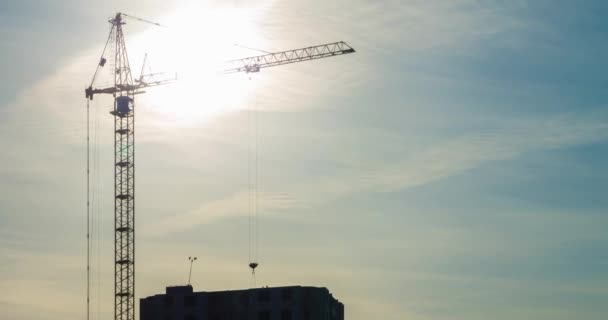 Time Lapse Silhouette Tower Crane Working Construction Rays Setting Sun — Stock Video