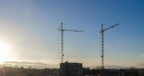Time Lapse Silhouette Tower Crane Working Construction Rays Setting Sun — Stock Video