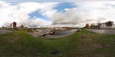 GRODNO, BELARUS - MAY 18, 2009: 360 panorama view near bridge across river with birds in sky. Full 360 by 180 degrees seamless panorama  in equirectangular spherical projection. skybox for VR content