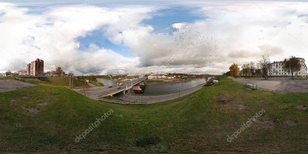 GRODNO, BELARUS - MAY 18, 2009: 360 panorama view near bridge across river with birds in sky. Full 360 by 180 degrees seamless panorama  in equirectangular spherical projection. skybox for VR content