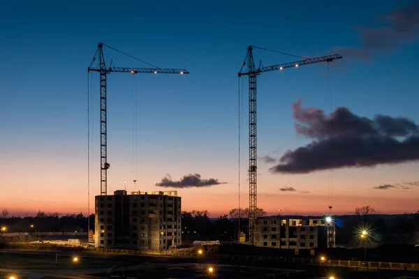 Tower Cranes Unfinished Multi Storey High Buildings Construction Site Sunset — Zdjęcie stockowe