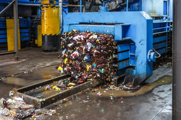 Separate garbage collection. Equipment for pressing debris sorting material to be processed in a modern waste recycling plant.