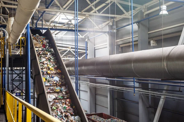 stock image moving conveyor transporter on Modern waste recycling processing plant. Separate and sorting garbage collection. Recycling and storage of waste for further disposal. 