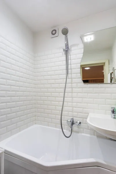 Detail of a corner shower cabin with wall mount shower attachment — Stock Photo, Image