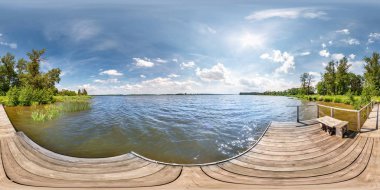 full seamless spherical hdri panorama 360 degrees  angle view on wooden pier of huge lake or river in sunny summer day and windy weather with beautiful clouds in equirectangular projection, VR content clipart